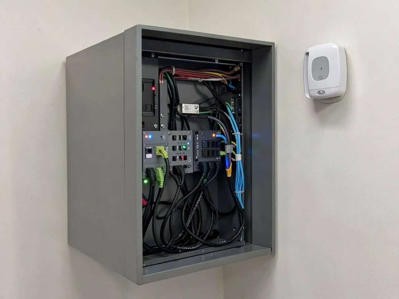 Structured data cabling being terminated in a commercial comms cabinet in Berkshire