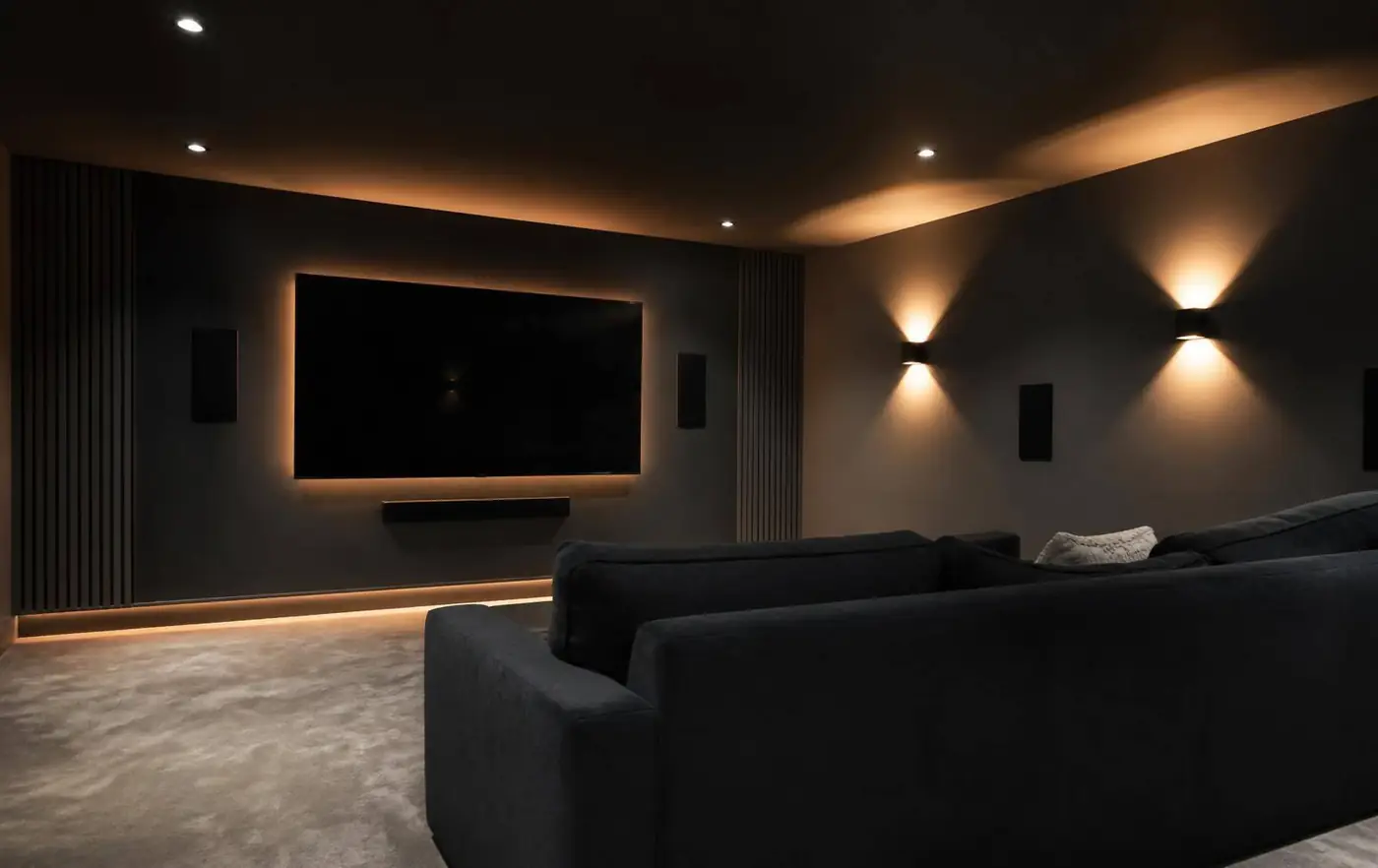 Finished home cinema room with large screen in a Berkshire property