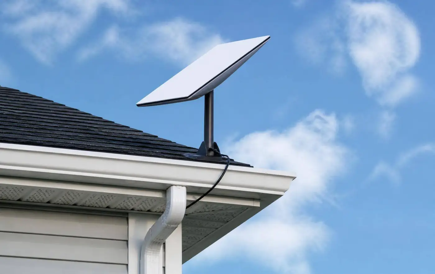 Starlink dish mounted on a rural farmhouse roof in Berkshire