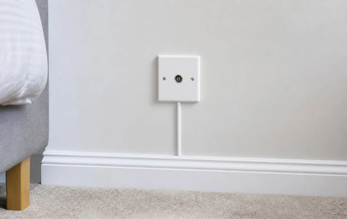 New aerial socket being fitted to a living room wall in Berkshire